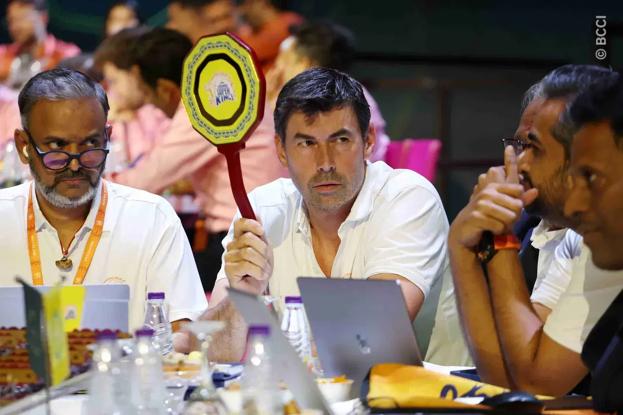 CSK head coach Stephen Fleming raising the paddle during the auction. Image | BCCI